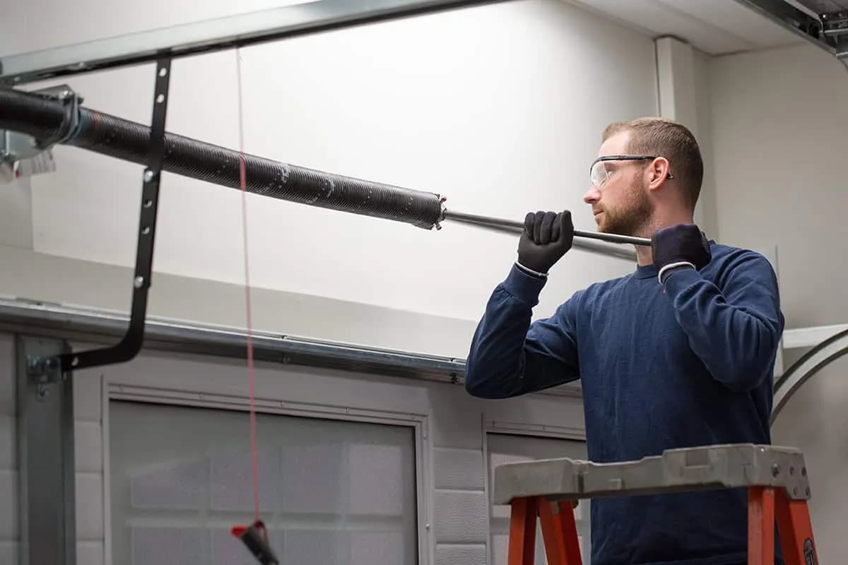 Garage door spring replacement being performed in Laguna Hills, CA