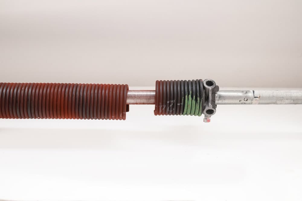 Visible gaps in garage door spring coils